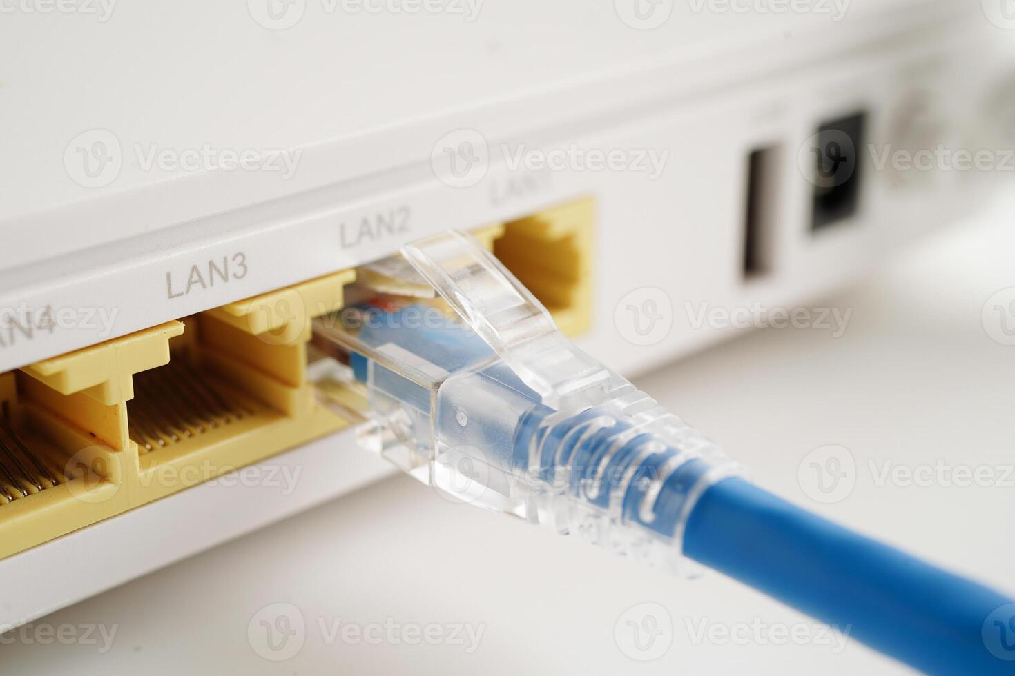 Ethernet cable with wireless router connect to internet service provider network. photo