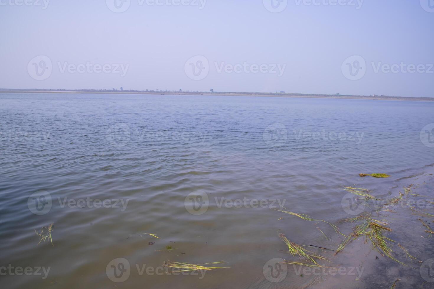 Natural Landscape view of the Bank of the Padma River with The Blue water photo