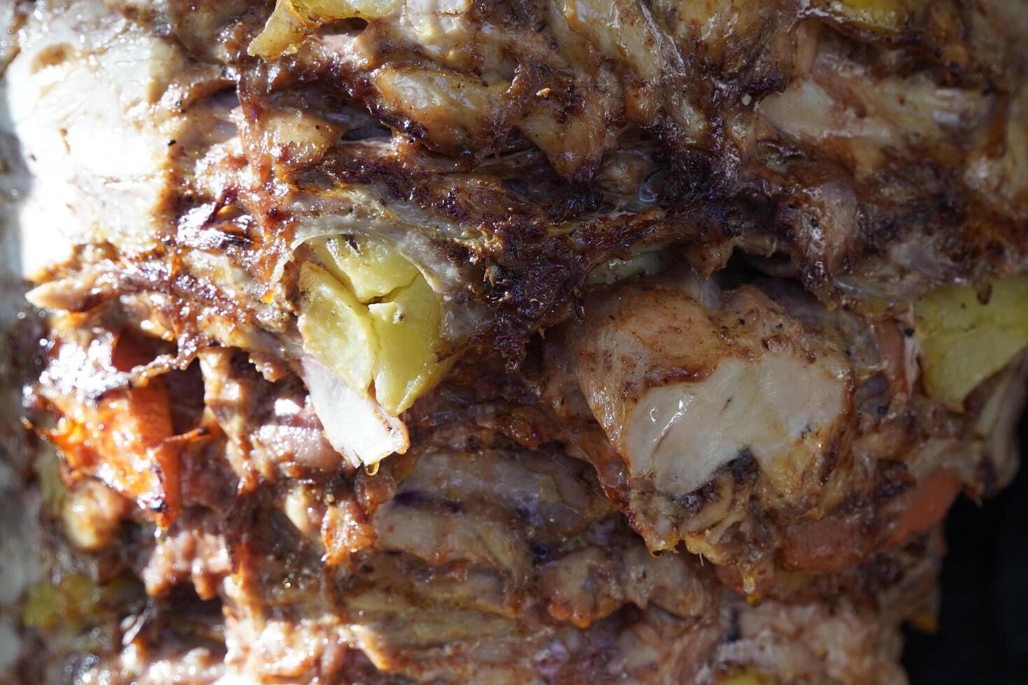 Turkish dish Doner Kebab as a turning roast photo