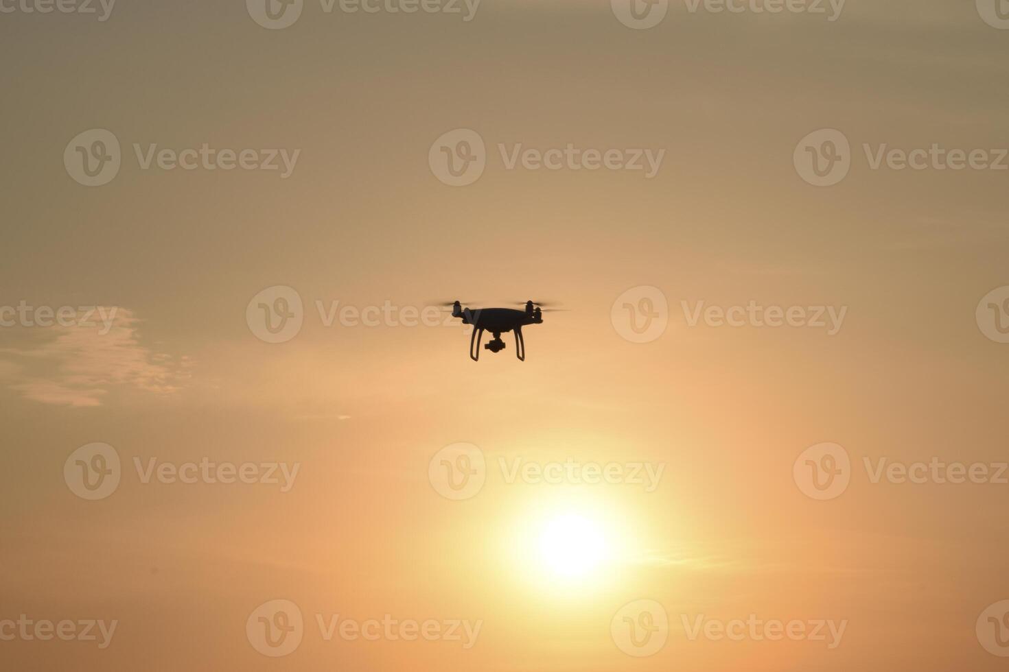 drone silhouette against the background of the sunset photo