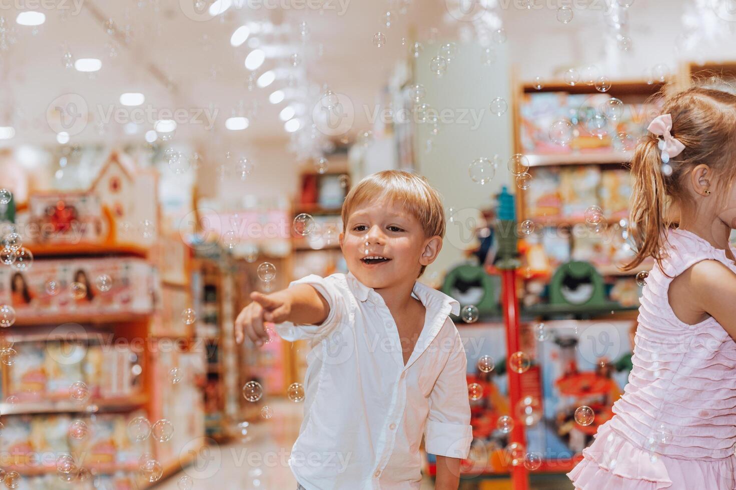 Happy Children Blowing Soap Bubbles photo