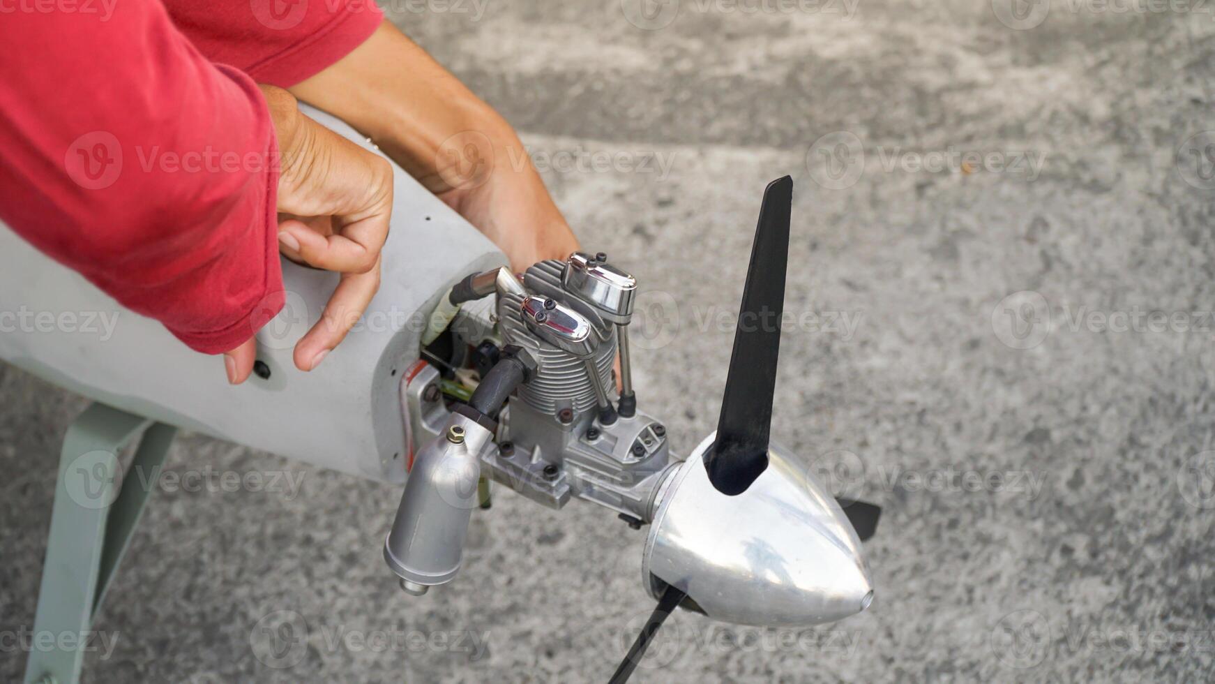 Engineer designing and assembling drones. Homemade aircraft made from resin and carbon fiber photo