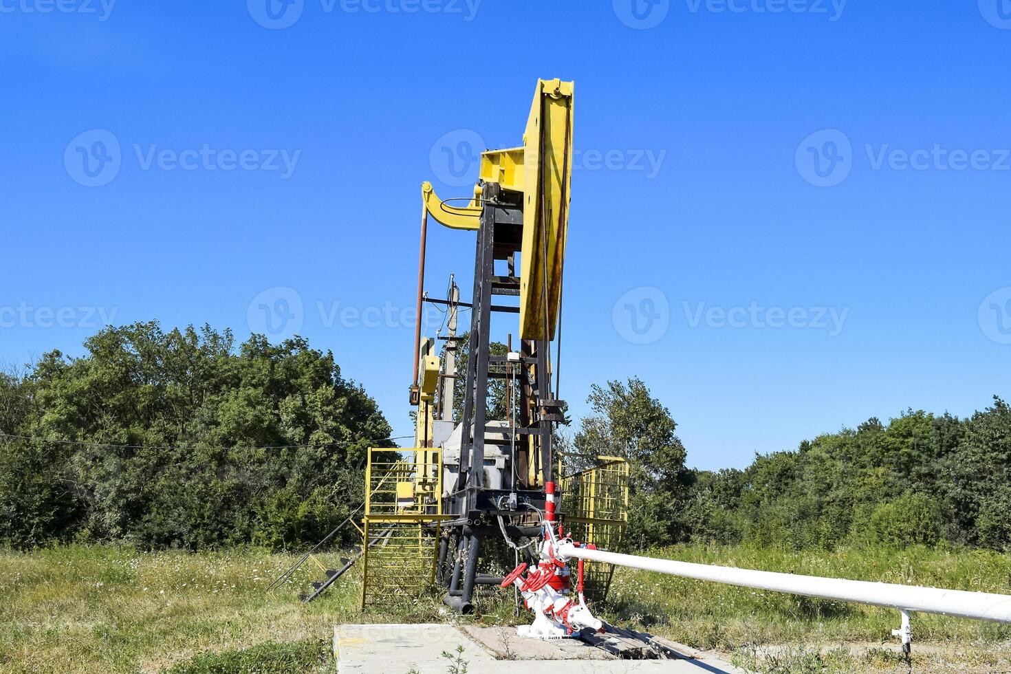 Pumping unit as the oil pump installed on a well photo