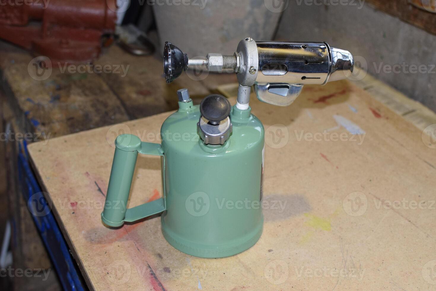 Blowtorch, general view. Blowtorch a with a green tank photo