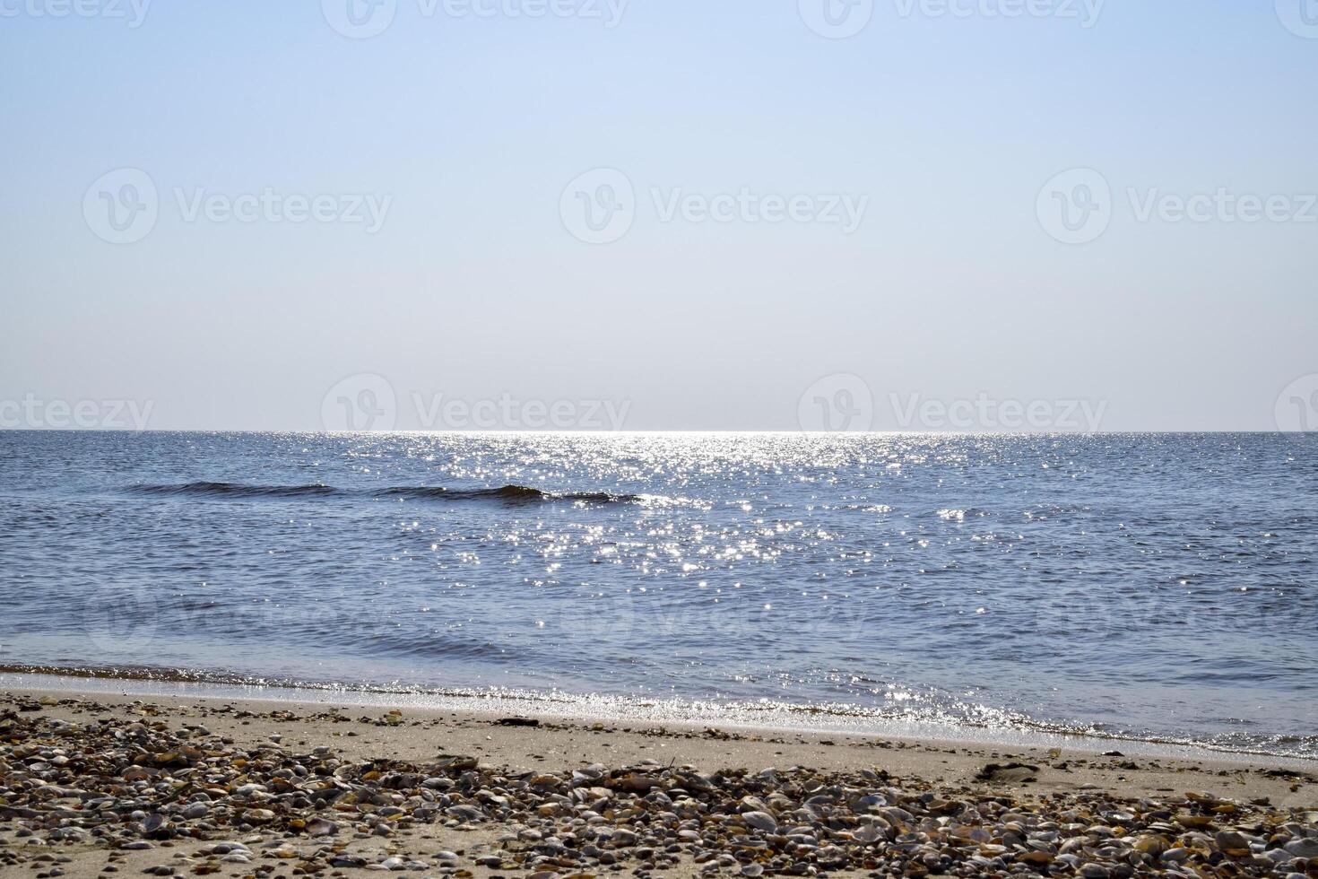 Sea line of the horizon. Sea and sky. The waves and glare of the sun are reflected from the waves of the sea. Seascape. photo