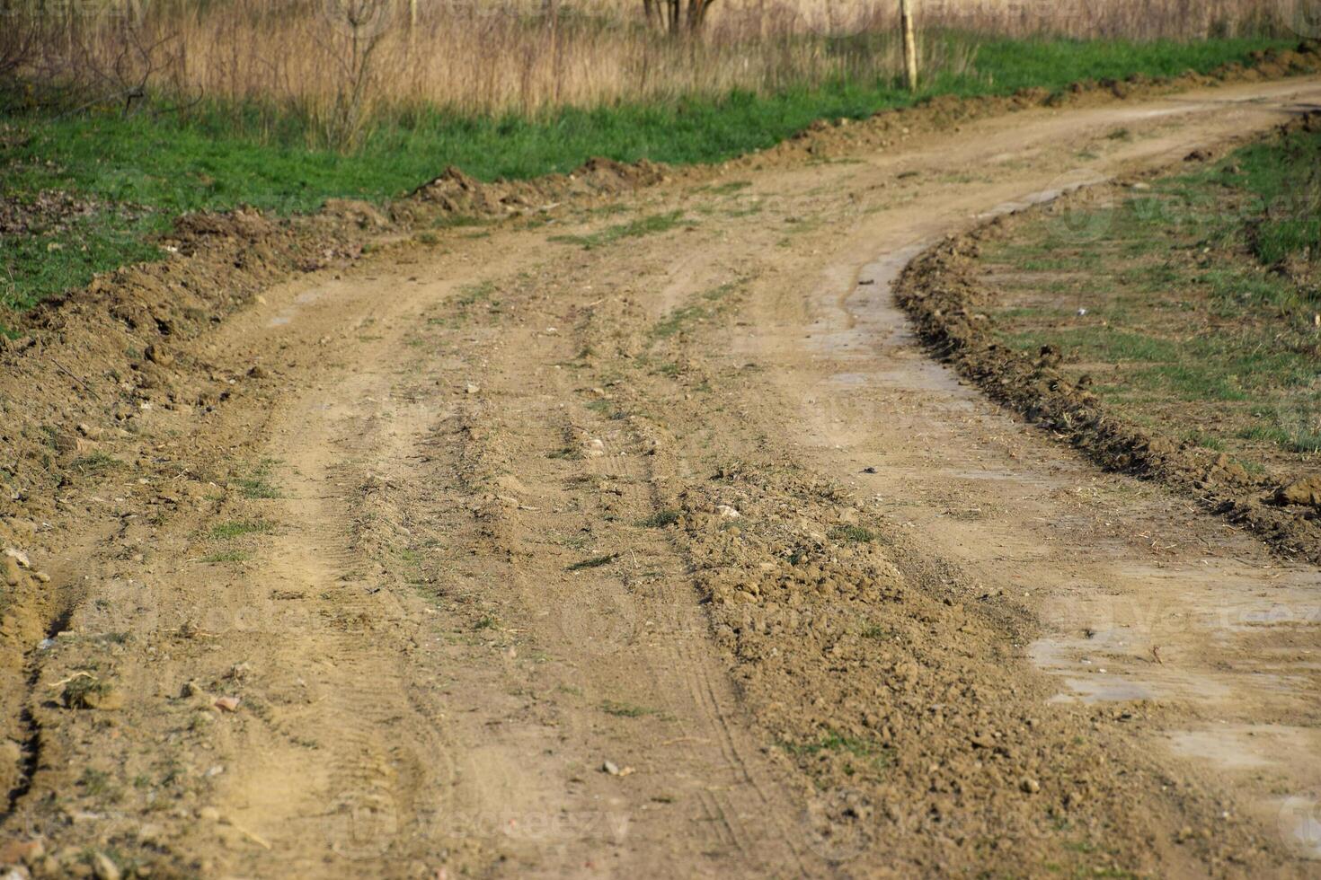 Dirt road leveled by a grader. Road in village photo