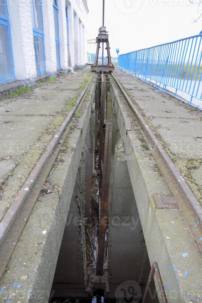 Slot lock water pumping station. Lock bolts. Hydraulic construction. photo