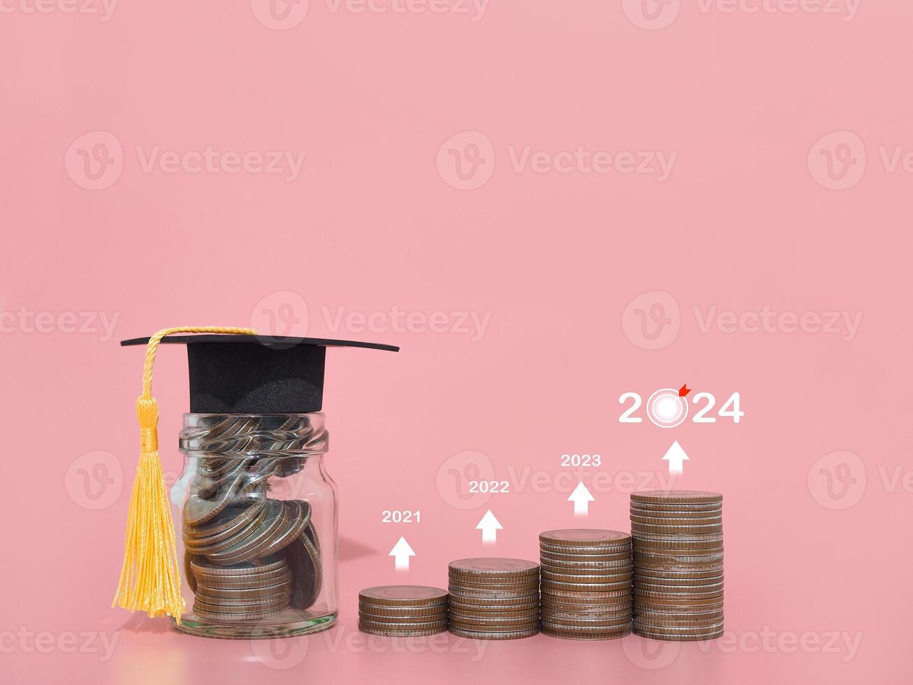 Study goals, Glass bottle  with graduation hat and stack of coins. The concept of saving money for education, student loan, scholarship, tuition fees in year 2024 photo