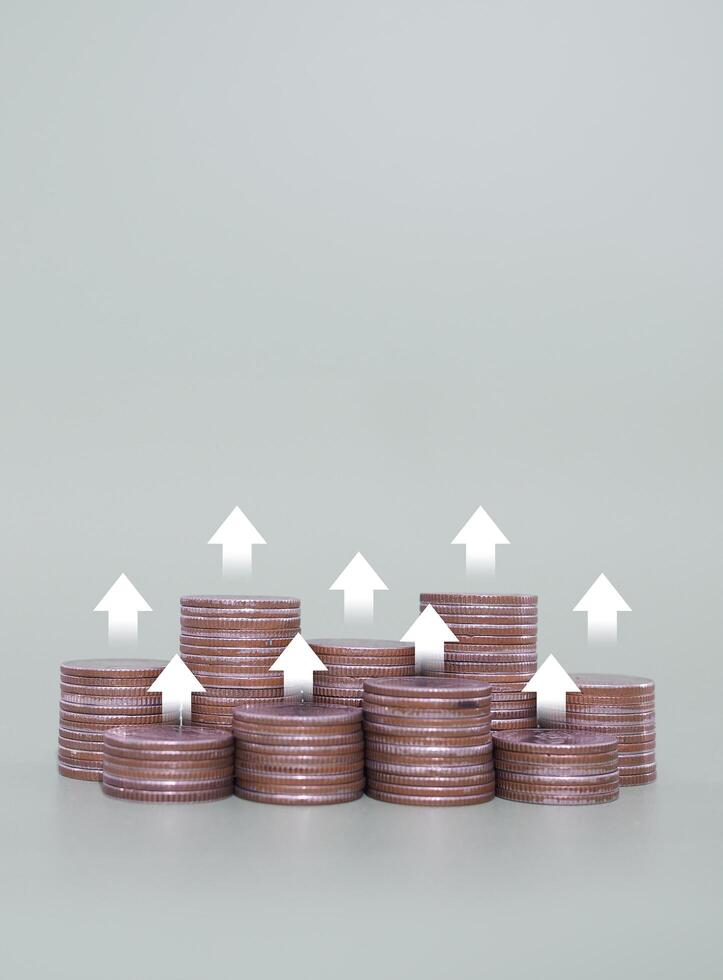 Stack of coins with arrow rising up icons. The concept of business growth, Financial investment, Market stock, Profit return, Dividend and Business fund. photo