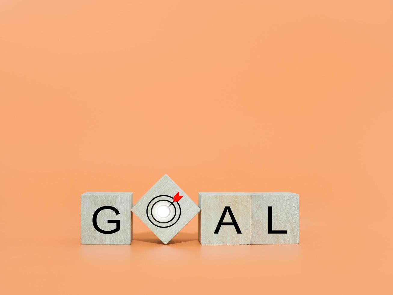 Wooden blocks with the word GOAL. The concept of Goal achievement , target, strategy and success photo