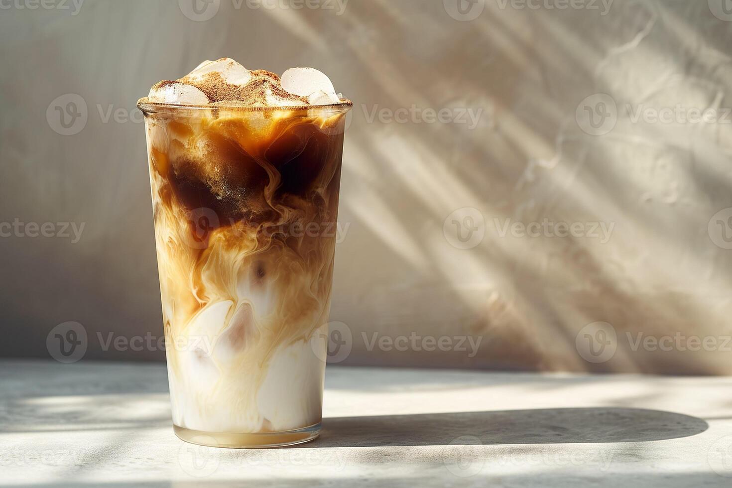 AI generated A glass of iced coffee with swirling clouds of cream blending into the dark coffee with cocoa powder. Generative AI photo