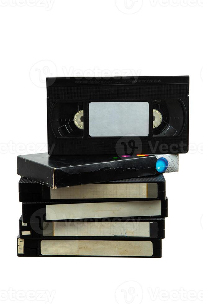 Pile of VHS video cassettes. Vintage media. Isolate on a white back. photo