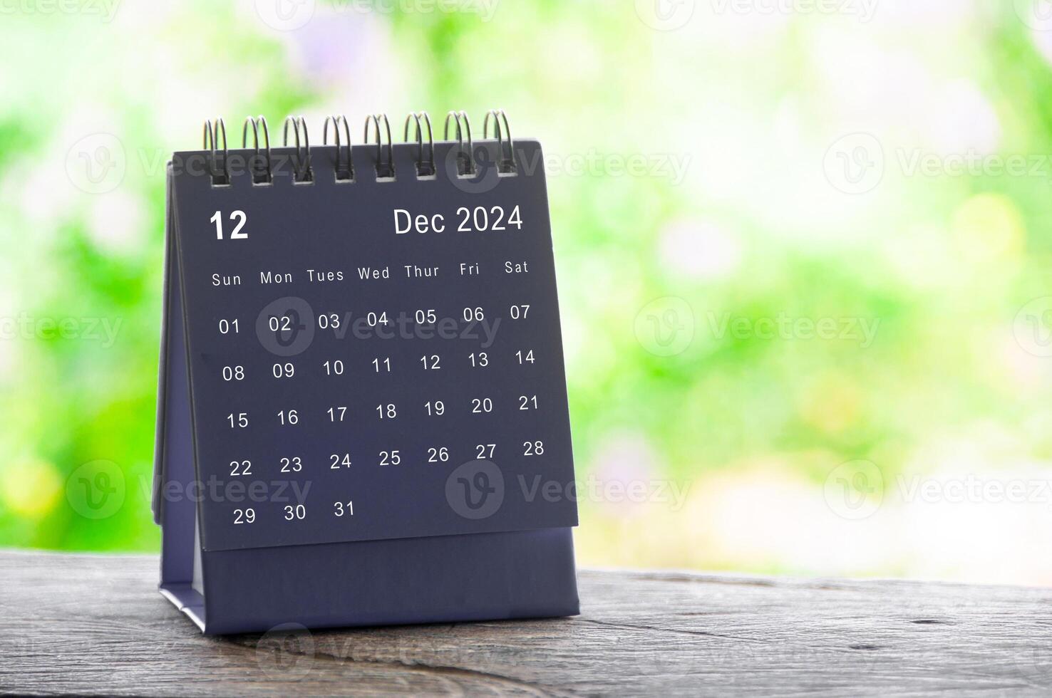 December 2024 table calendar with nature background. Calendar and month concept photo