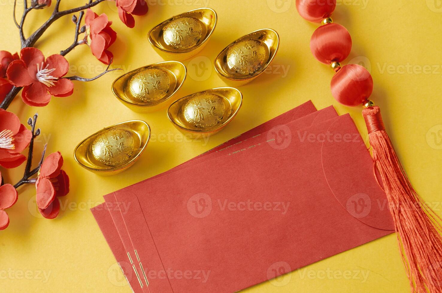 Chinese New Year red packet and golden ingot with customizable space for text or wishes. Chinese New Year celebration concept. photo