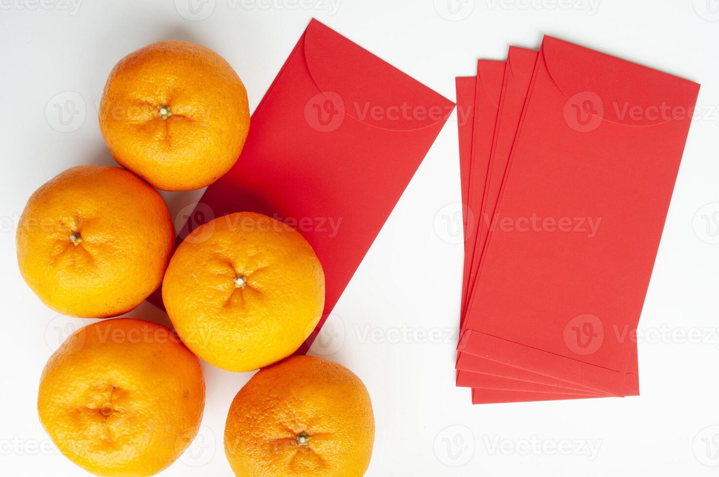 Top view of Mandarin oranges and Chinese New Year red envelope. Chinese New Year celebration concept photo