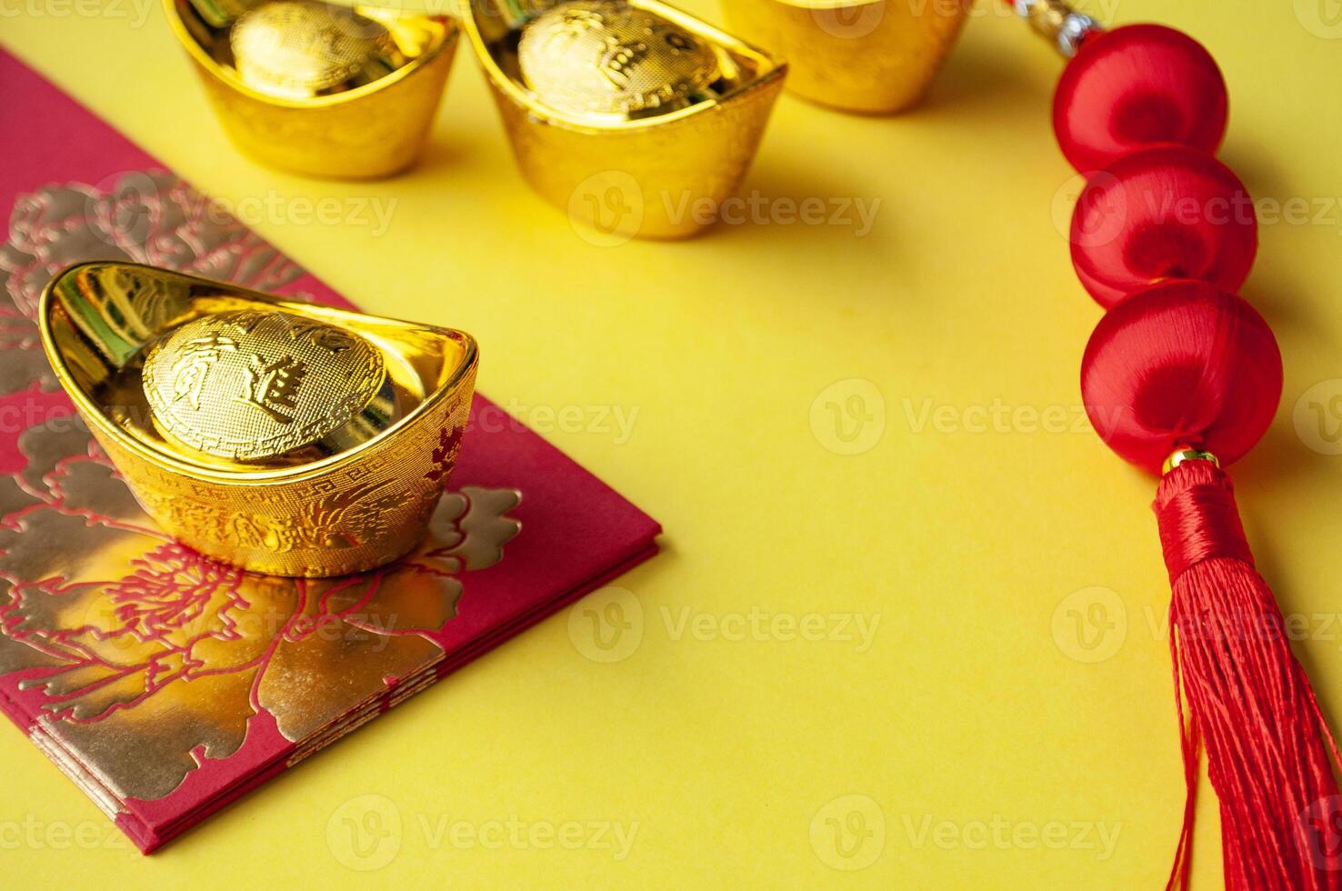 Chinese New Year red packet and golden ingot with customizable space for text or wishes. Chinese New Year celebration concept photo