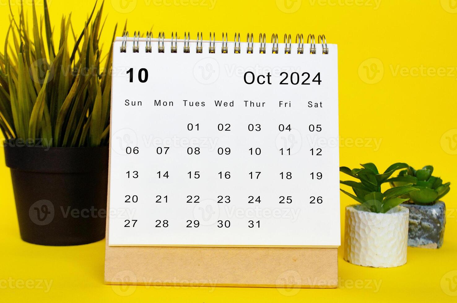 October 2024 calendar with yellow over background. Monthly calendar concept photo