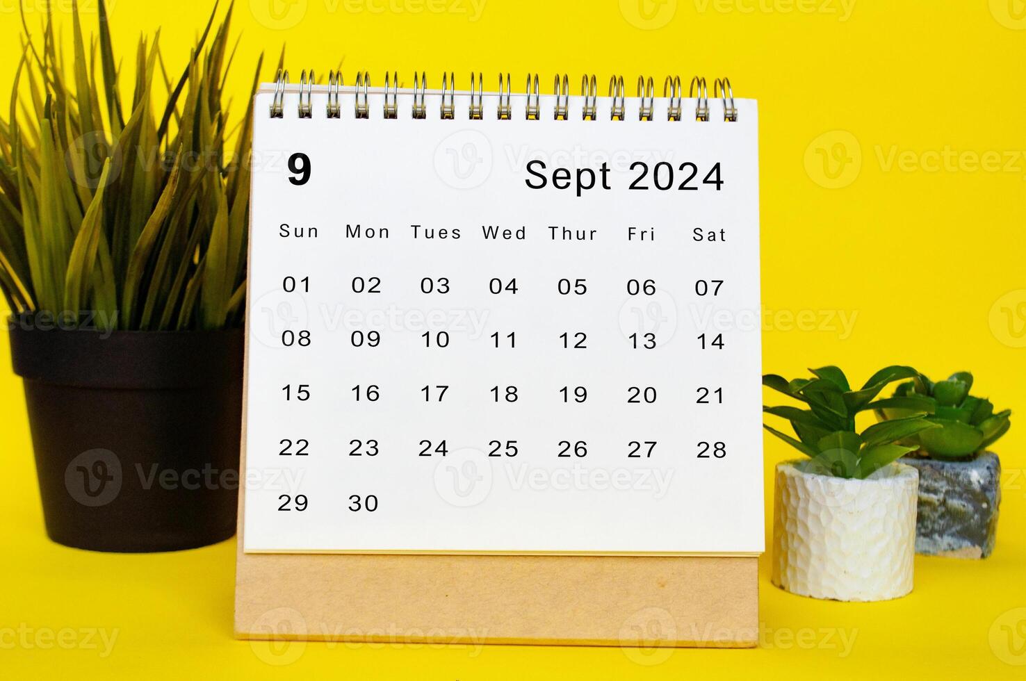 September 2024 calendar with yellow over background. Monthly calendar concept photo