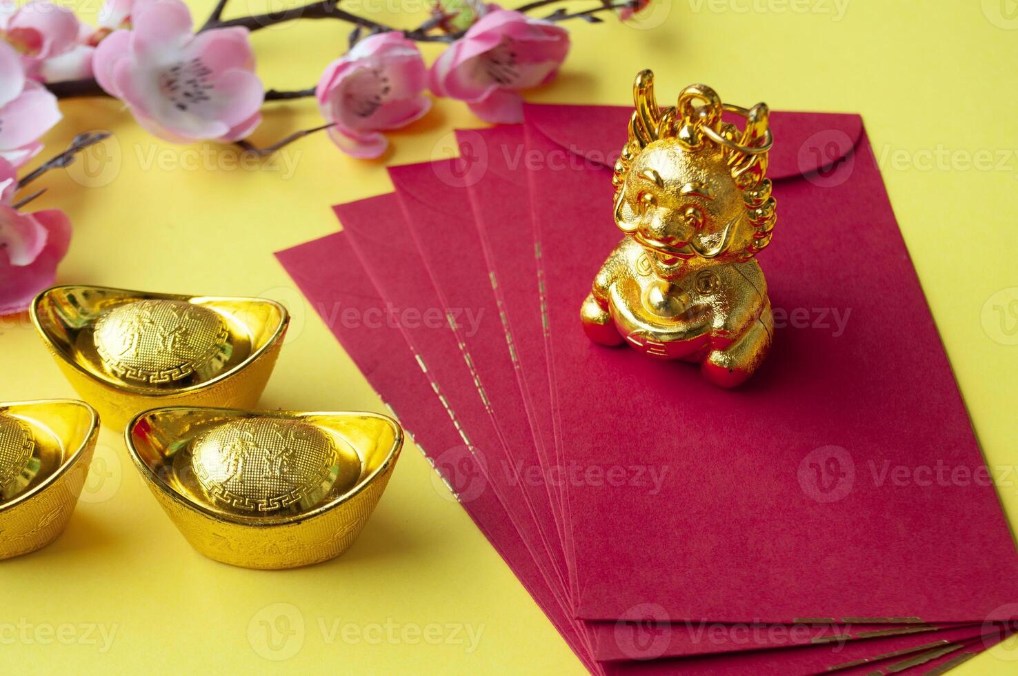 Golden Dragon on top of Chinese New Year red packet. Chinese New Year celebration concept photo