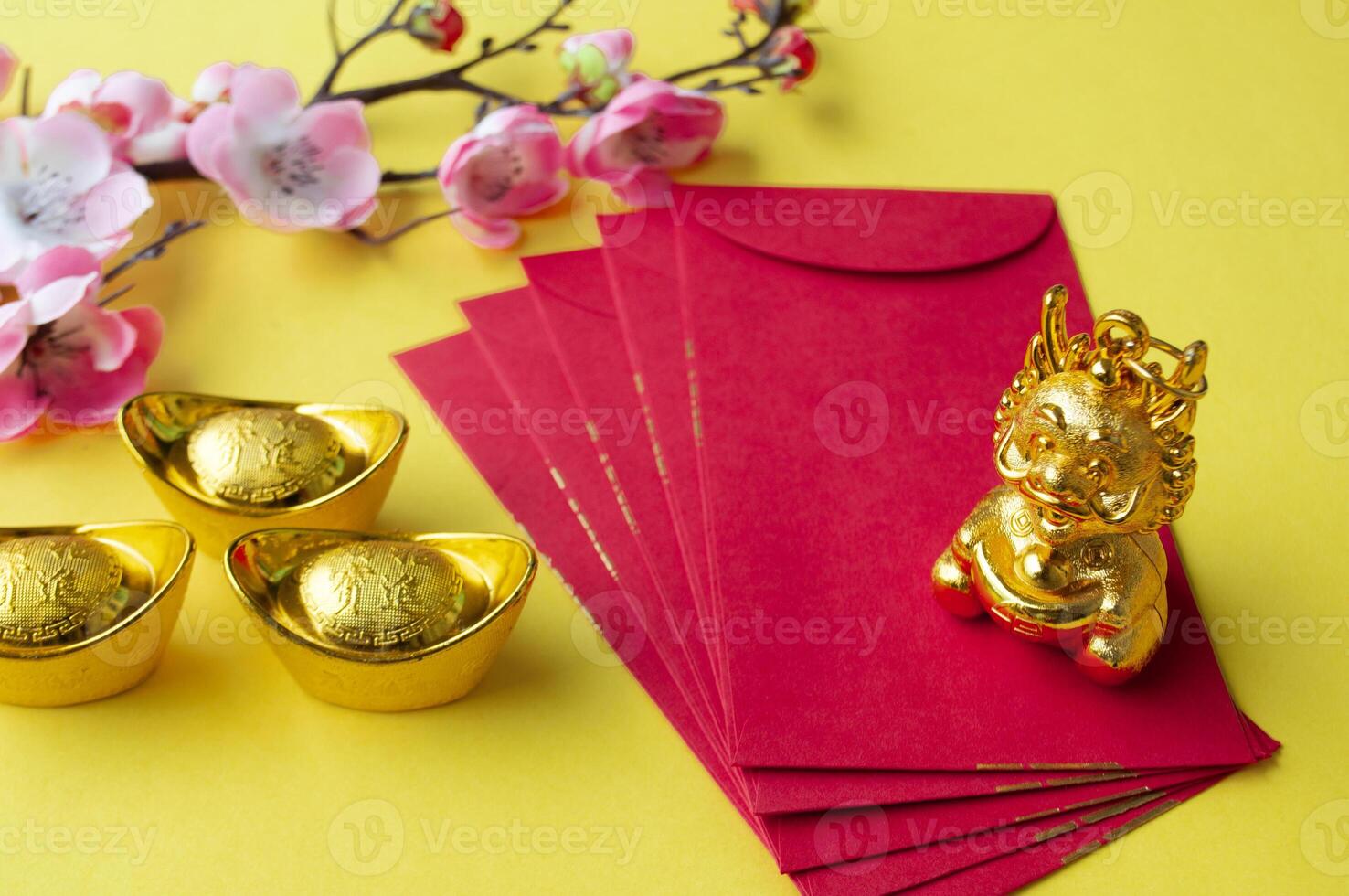 Golden Dragon on top of Chinese New Year red packet. Chinese New Year celebration concept photo