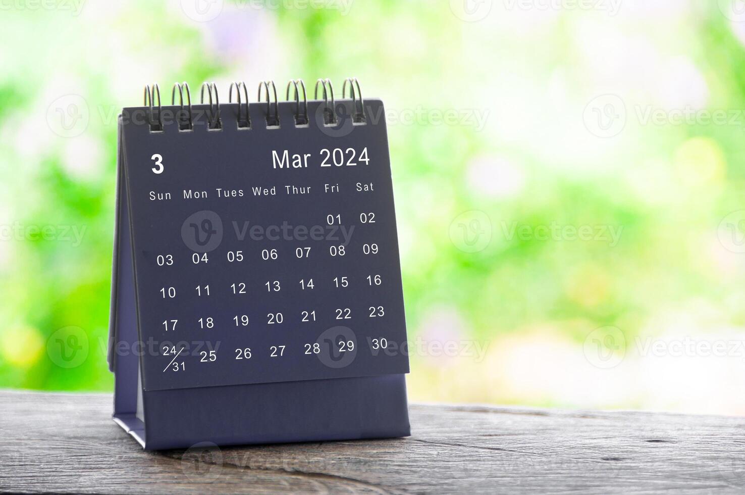 March 2024 table calendar with nature background. Calendar and month concept photo