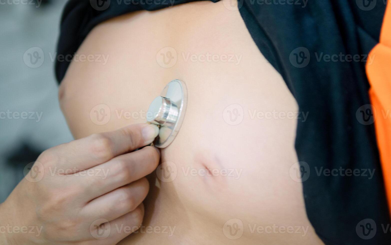 Stethoscope concept of fat children with belly photo