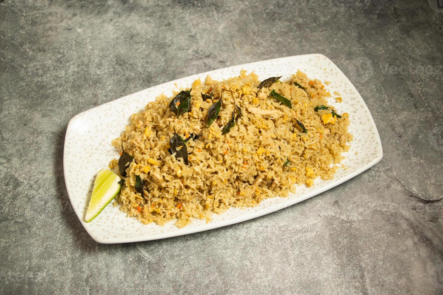 Green Curry Fried Rice with lime served in dish isolated on background top view of bangladeshi food photo