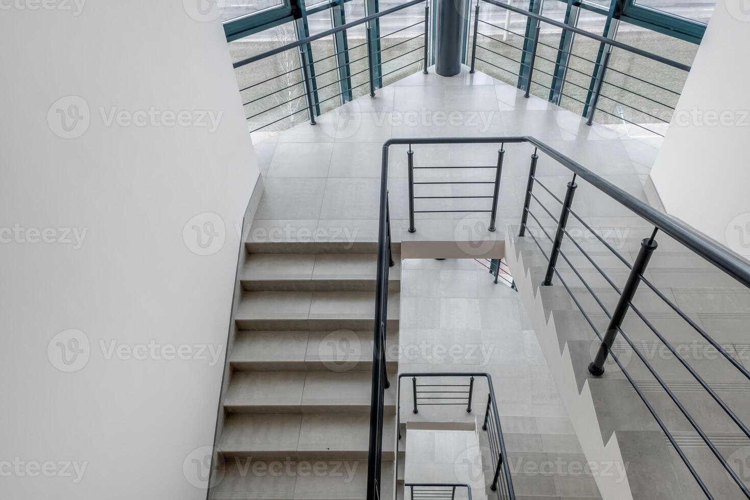 stairs emergency and evacuation exit stair in up ladder in a new office building photo