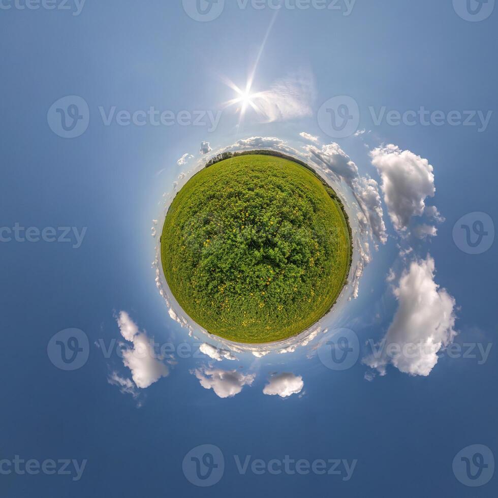 simple tiny planet without buildings in blue sky with beautiful clouds. Transformation of spherical panorama 360 degrees. Spherical abstract aerial view. Curvature of space. photo