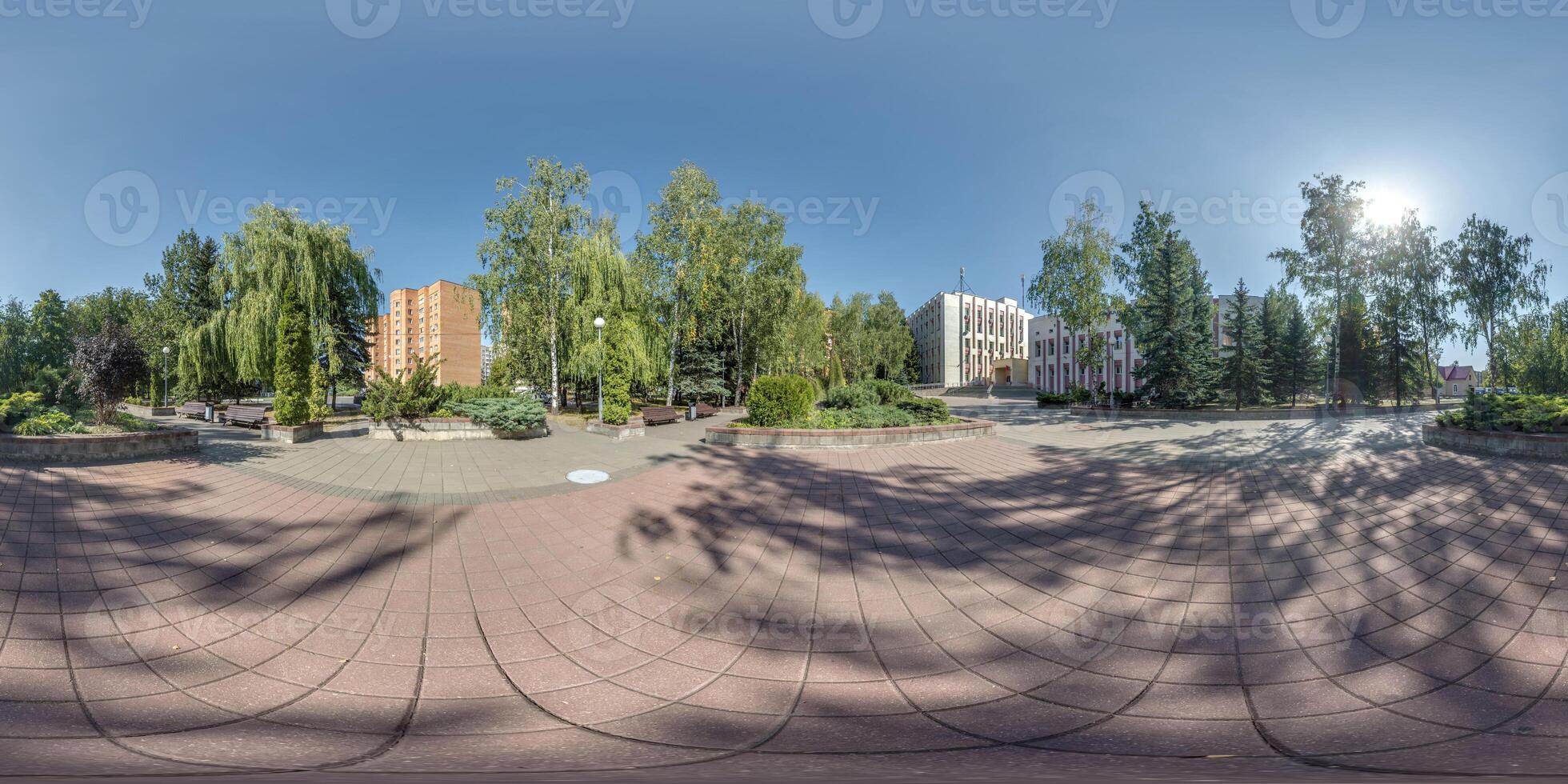 seamless spherical hdri 360 panorama view on square with trees near residential area with multi-storey and office building and urban development in equirectangular projection, AR VR content photo