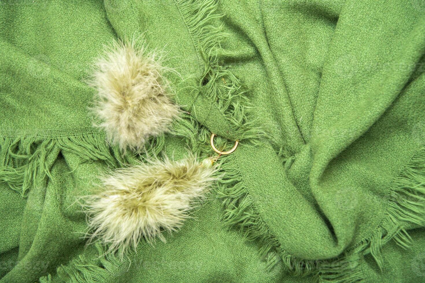 bright green scarf with fringe, natural background, fashion accessory for autumn photo