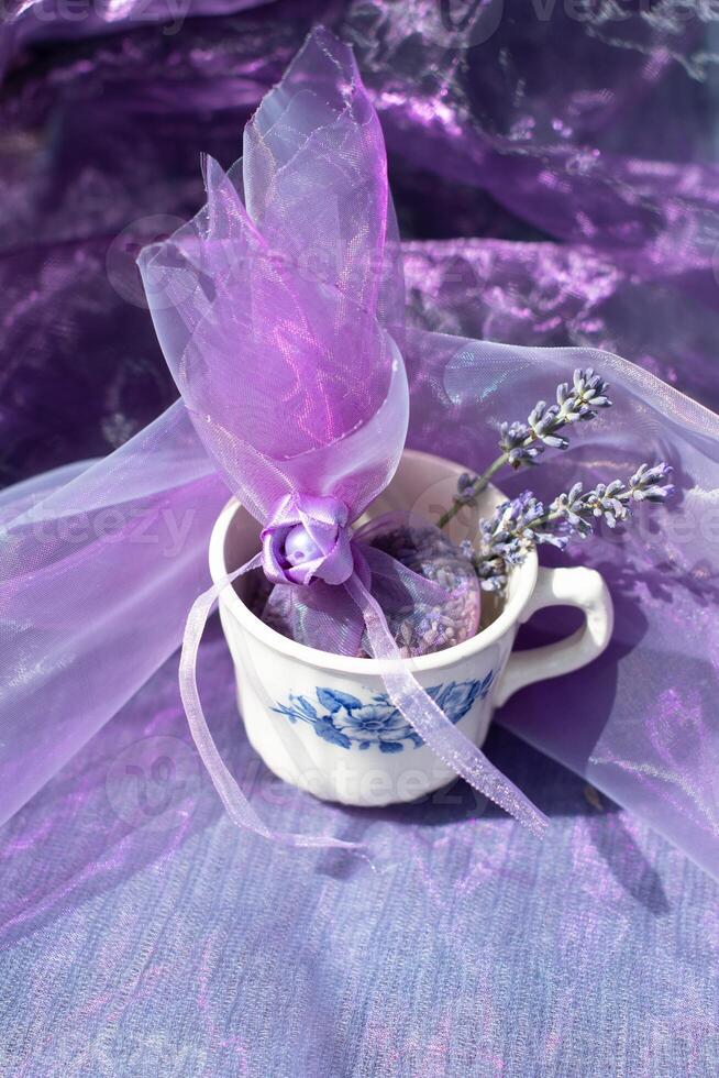 Lilac lavender sachets in vintage cup, chiffon bag for aromatherapy,still life photo