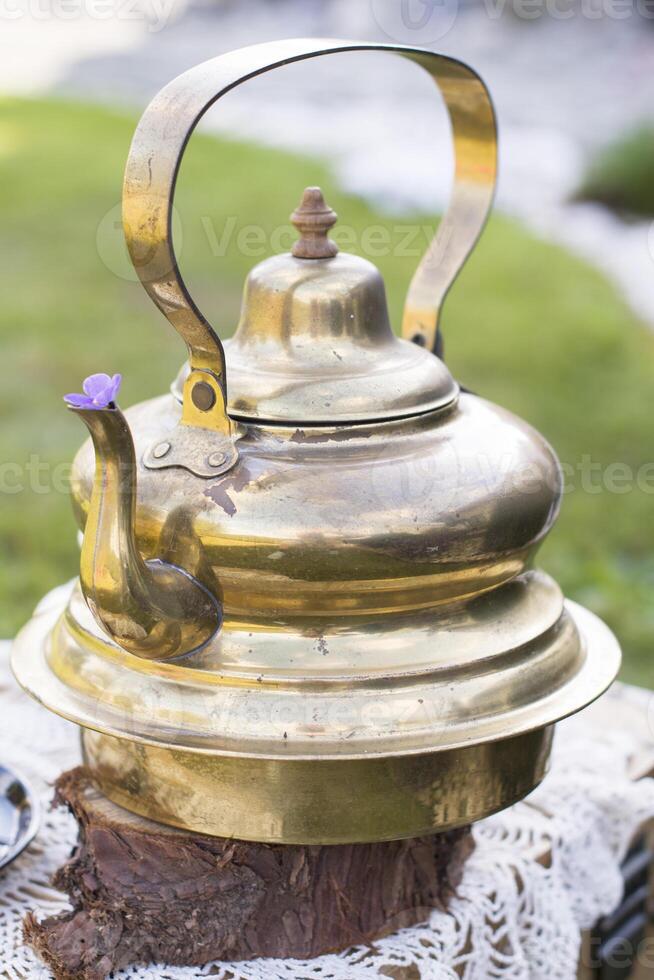copper vintage teapot at picnic photo