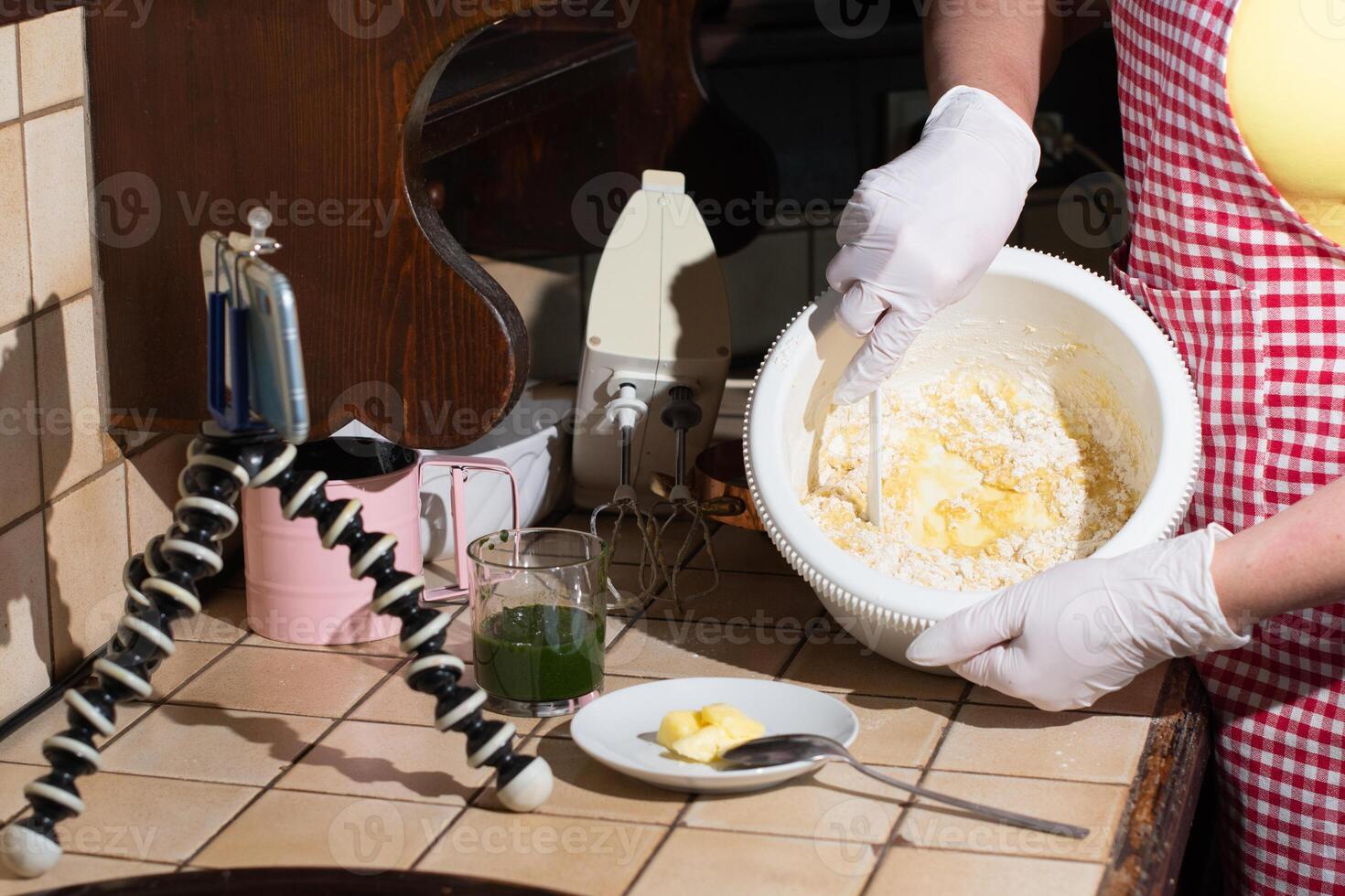 woman cooking spinach muffins step by step, mixing ingredients with spatula photo