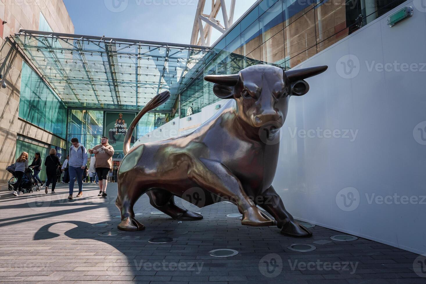Bullring's Dynamic Bull Statue Basks in Birmingham, UK Sunshine photo