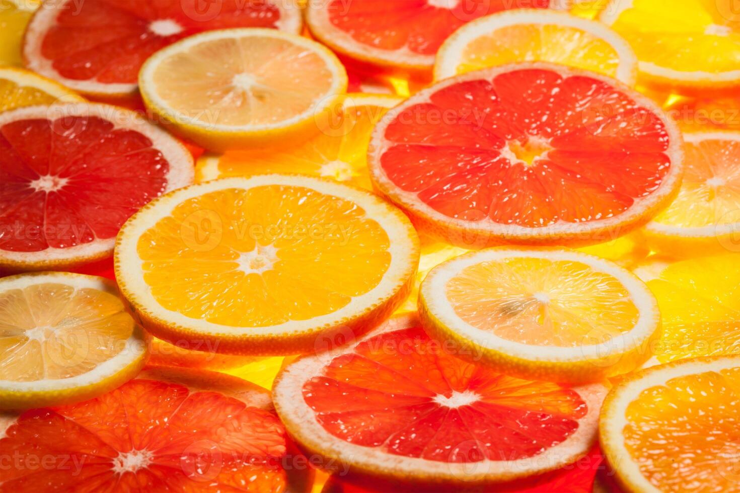 Colorful citrus fruit slices photo