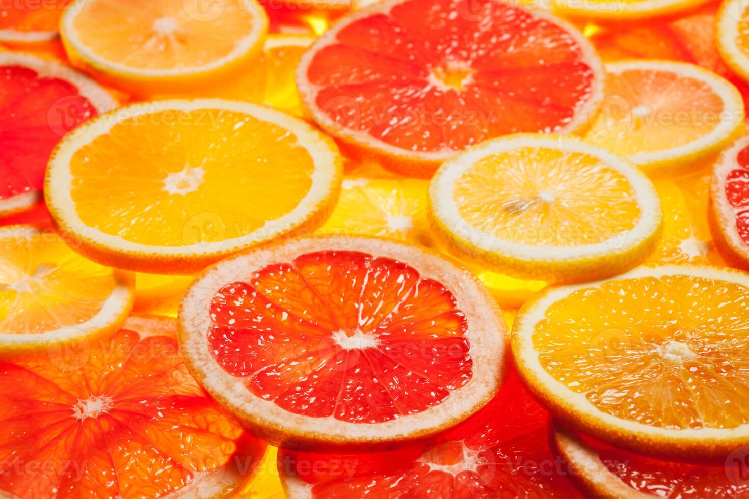 Colorful citrus fruit slices photo