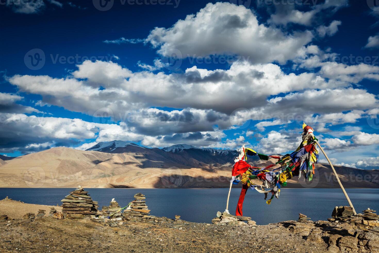 Buddhist prayer flags lungta at Himalayan lake photo