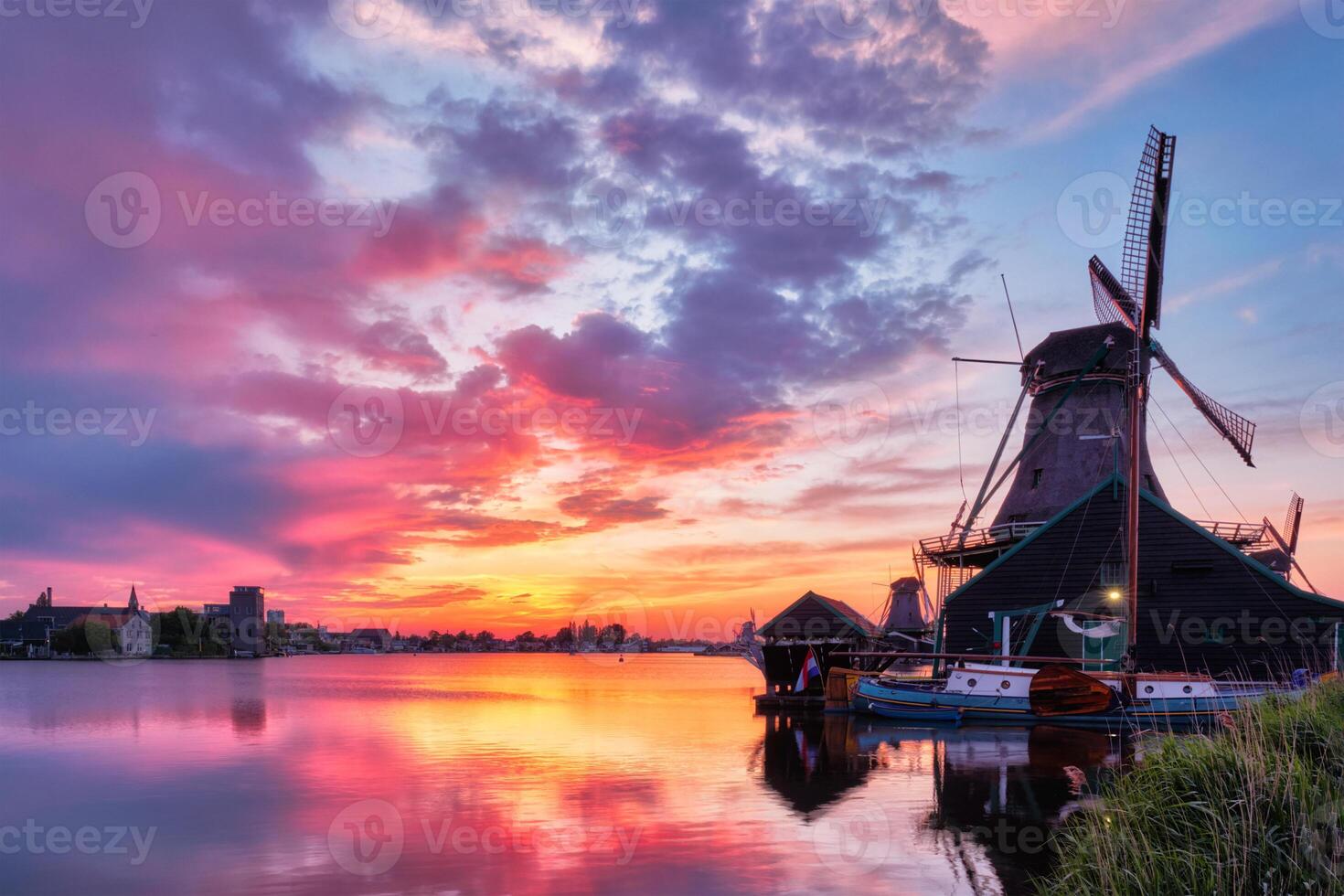 Windmills at Zaanse Schans in Holland on sunset. Zaandam, Nether photo