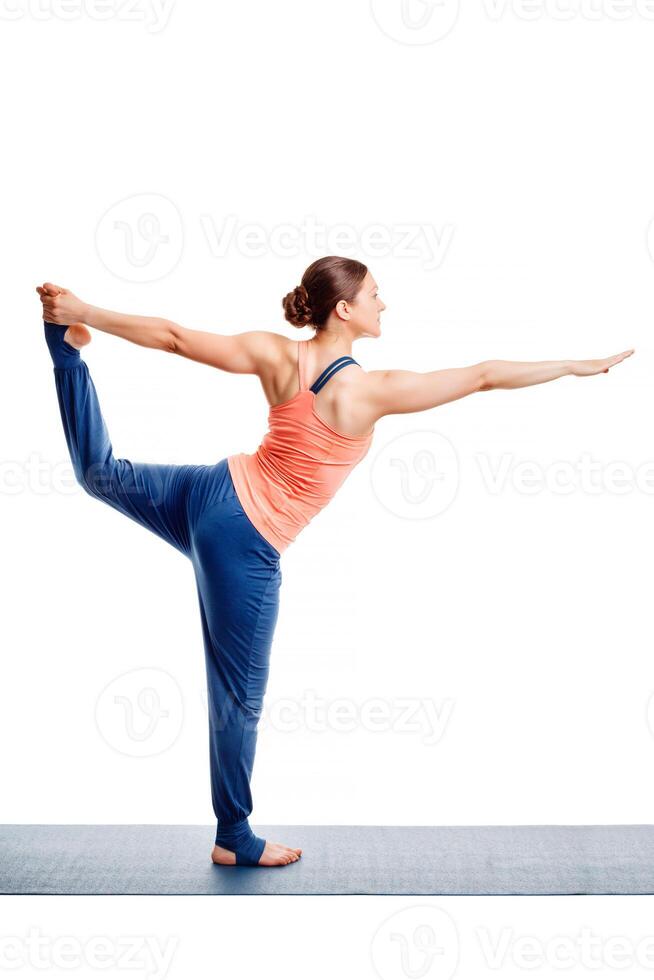 Woman doing yoga asana Natarajasana photo