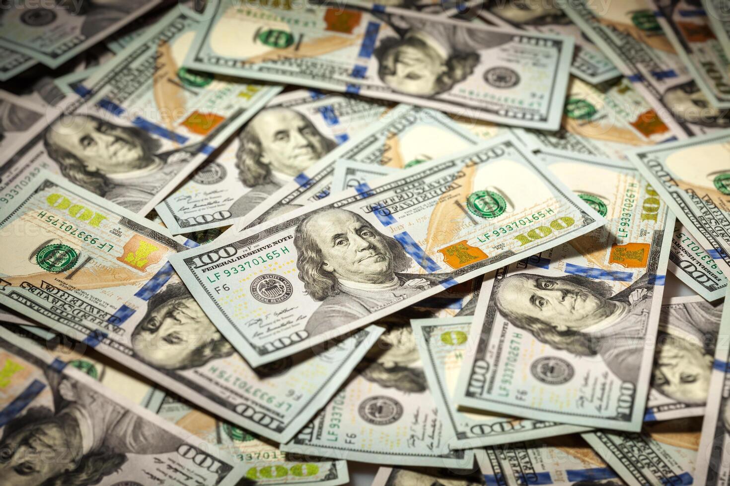 Background of hundred dollars bank notes photo
