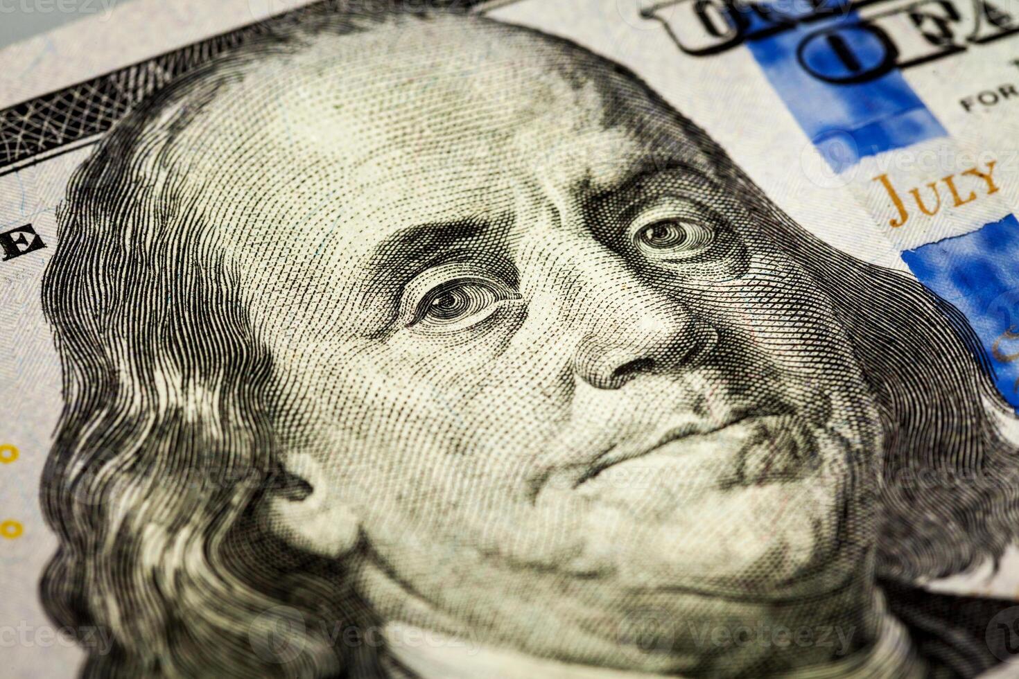 Benjamin Franklin portrait macro shot of 100 bill photo