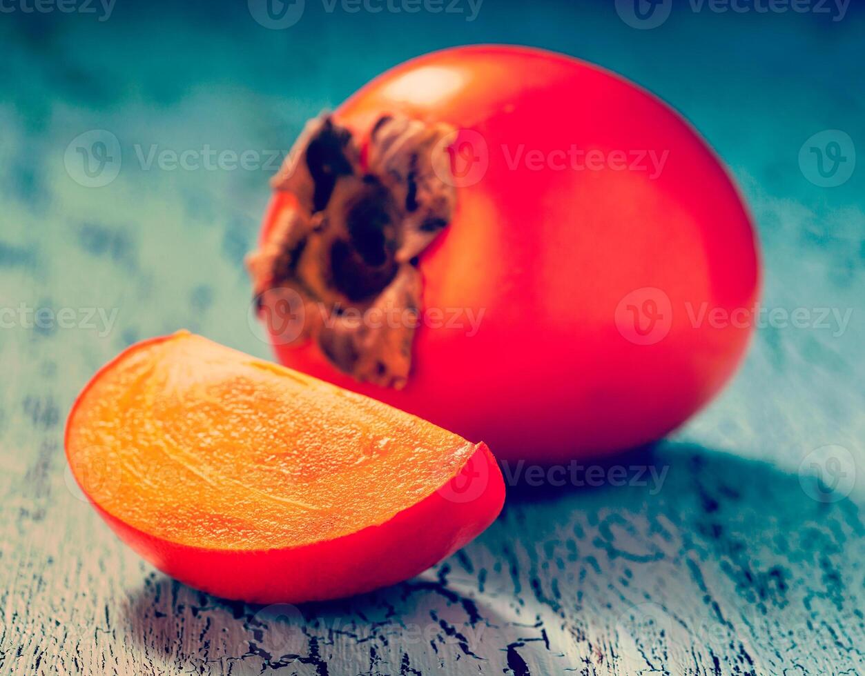 Persimmon close up on table photo