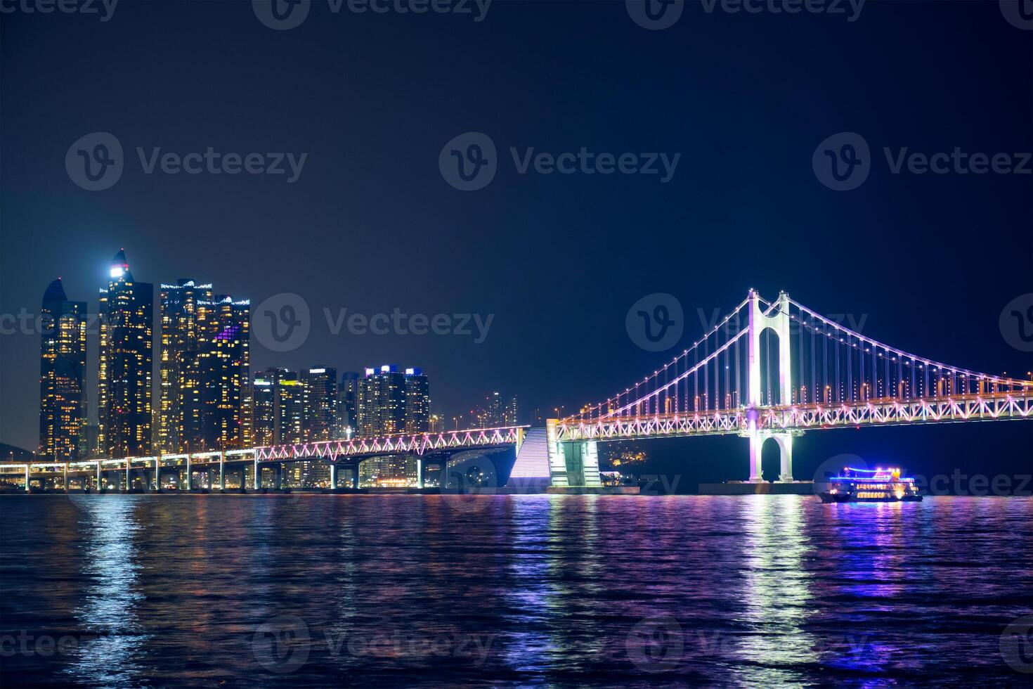 Gwangan Bridge and skyscrapers in the night. Busan, South Korea photo