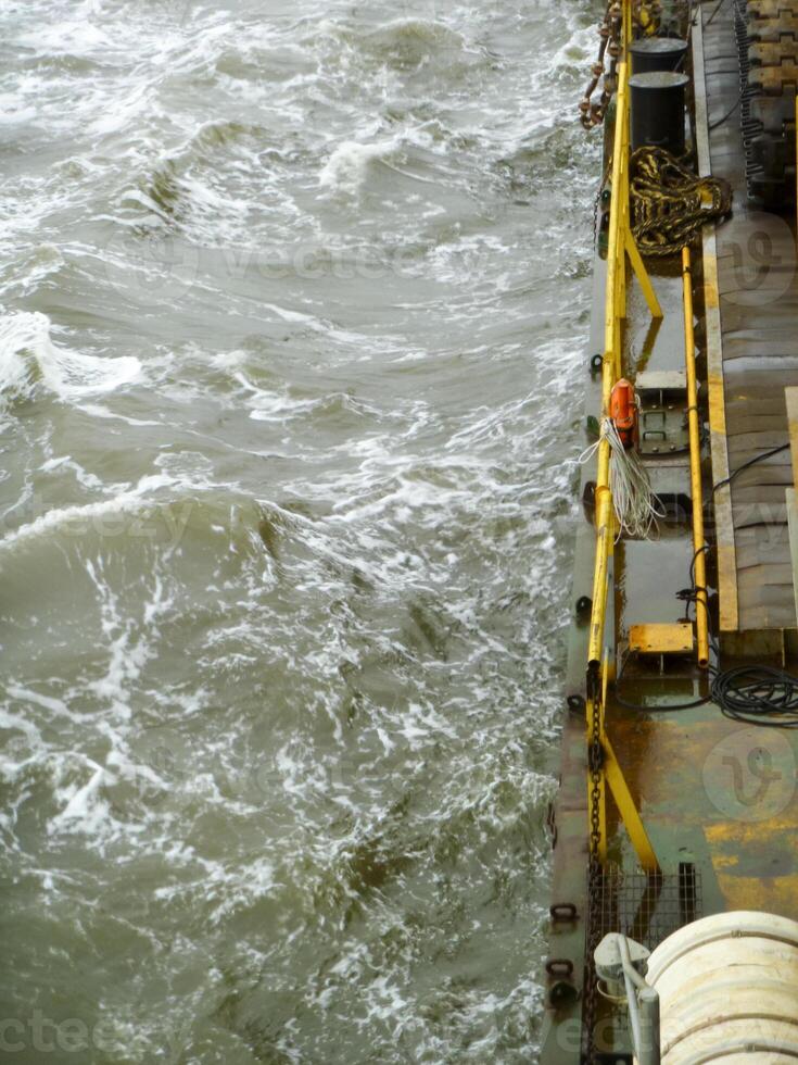 Ship in the sea. The edge of the barge deck photo