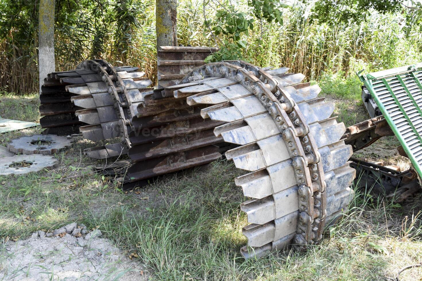 Old caterpillar tract from the combine photo