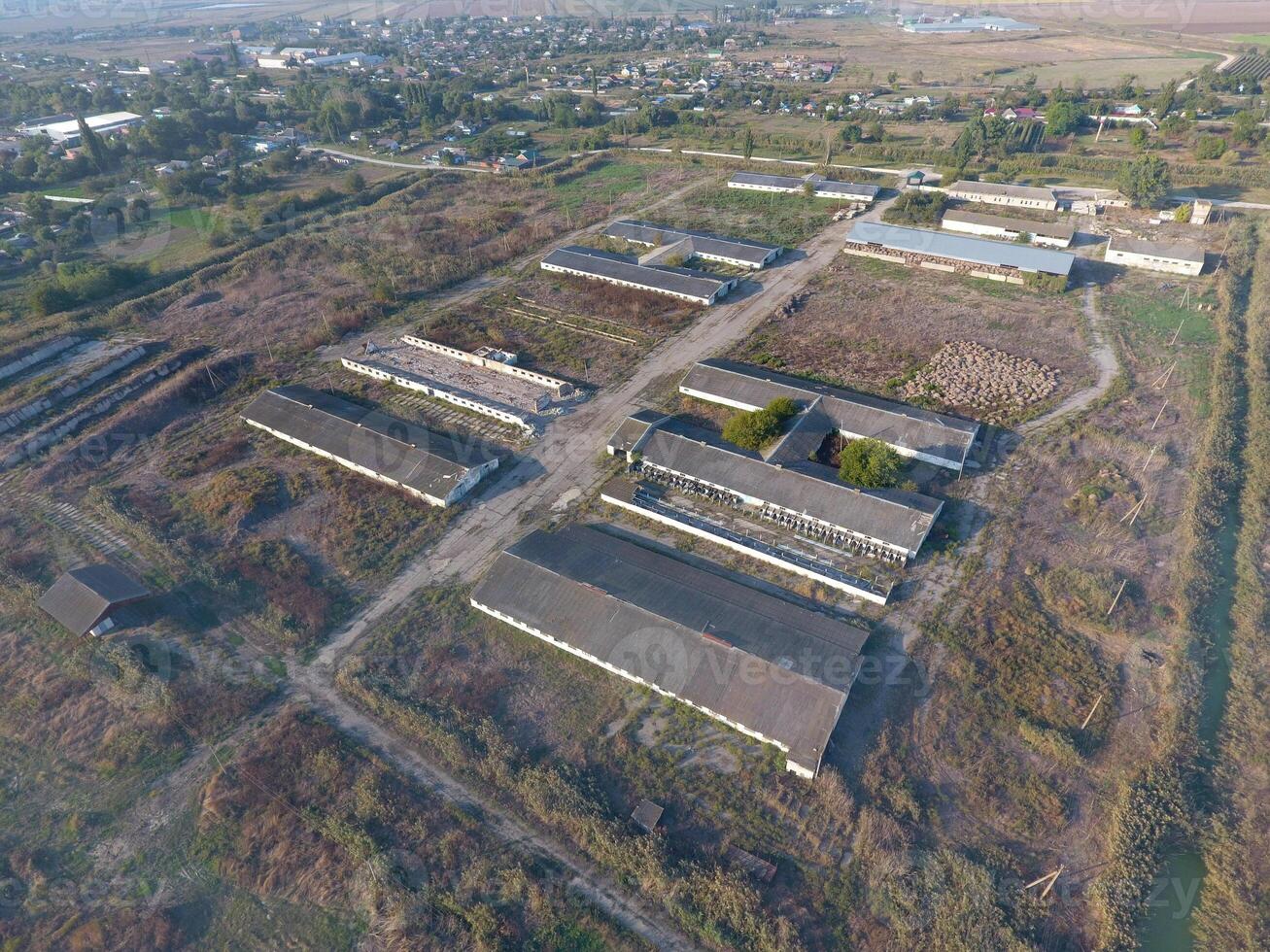 The building of an old farm for cattle. Top view of the farm. Storage of bales of hay on the old farm photo
