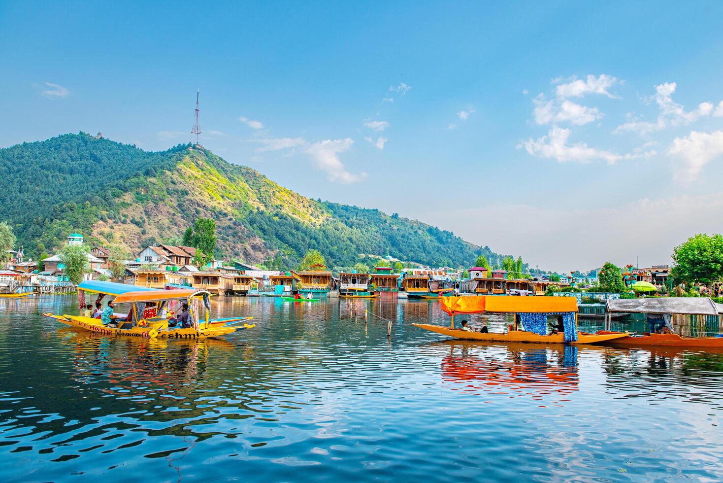 Dal Lake and the beautiful mountain range in the background, in the summer Boat Trip, of city Srinagar Kashmir India. photo