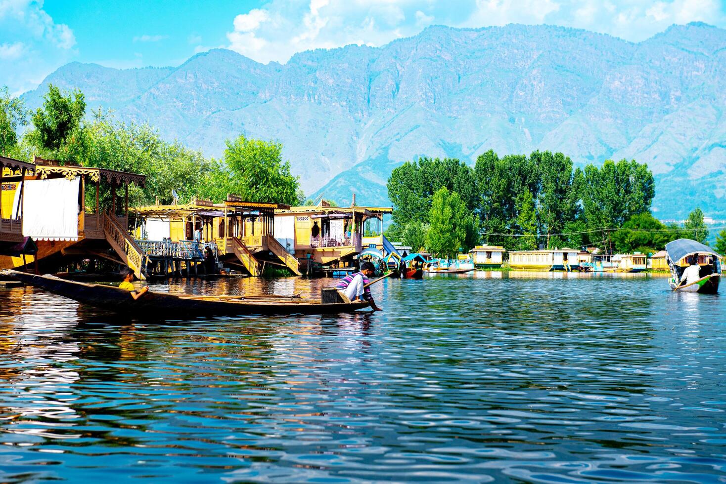 Dal Lake and the beautiful mountain range in the background, in the summer Boat Trip, of city Srinagar Kashmir India. photo