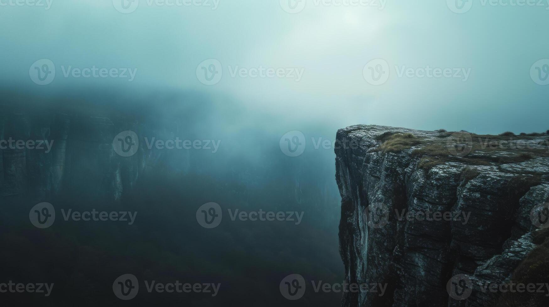 AI generated Rock cliff edge against a fog and clound dark sky with mountain photo